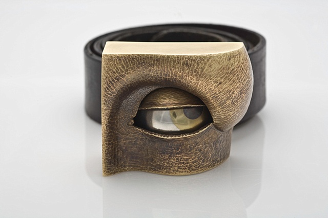 Eye, belt buckle, articulated, automaton, rock-star, magic, power, lust, sex