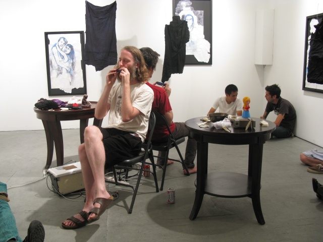 performers adam overton and ezra buchla at the opening