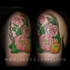 Tara's peony, ranunculous, pussy willow and fern piece on her arm