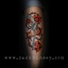 Steph's revolver, flowers and badge on her leg