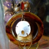 Amber disk with shell necklace