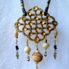 Gold brooch finding necklace with danglies