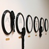 Ten 'Extinction Portraits' lined the back wall, each with a museum-style brass plaque underneath, stating the species name and extinction date for each piece
