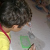 Four year old working on clay project.