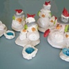 Snowmen hugging with red birds.