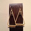 gold triangles with black spinel