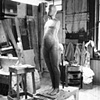 Polaroid of original clay sculpt of six foot FM figure with 24 inch reference casting, circa 1966.