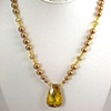 Golden Cubic Zirconia with gold pearls and Swarovski Crystal