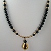 Gold pendant with Onyx