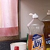 Still Life with Dirty Dishes and Pink Curtains
