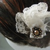 feathers and lace hair fastener.