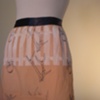 fenced in an apron (navy). (detail)