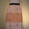 fenced in an apron (navy).