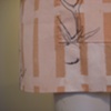 fenced in an apron (navy). (detail)