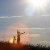 in which the sun blesses our silhouette dance on the hillside with a lens flare