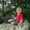 boy on large rock