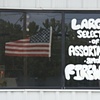 Flag In The Window Of A Fireworks Store