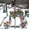 Flags On A Grave In The Snow