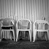 3 Chairs On A Loading Dock