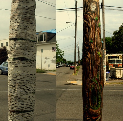telephone poles wrapped in bark paintings