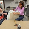 Community Volunteers assisting with the creation of the cushions
