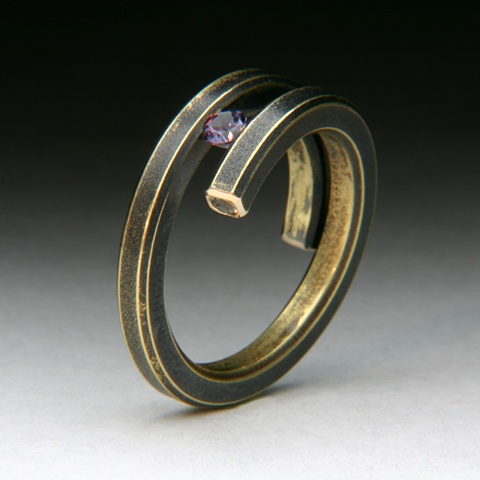 Bi-Pass Coil 14 karat yellow Gold Ring tension set with a Color change Garnet and two hidden end stone