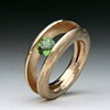 Tension set Green Tourmaline set in a Custom Alloy Ring