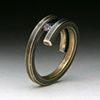 Bi-Pass Coil 14 karat yellow Gold Ring tension set with a Color change Garnet