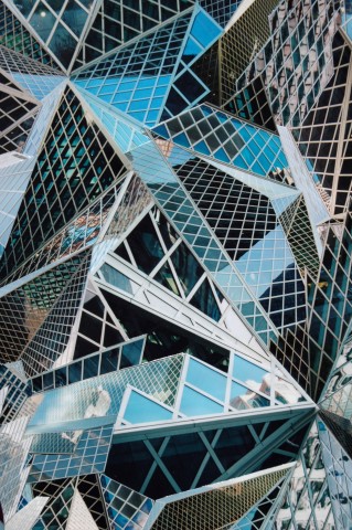 Photo collage by John Schuh featuring the American Flag and downtown Seattle Public Library.