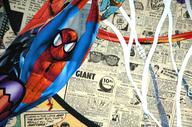 Collage by John Schuh featuring comic books and Dr. J Julius Erving.