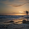 Photographer setting up for sunset shot