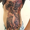 Goat head/woman/battle axe/hourglass with lions legs