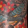 skull and snake tattoo