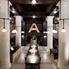 Ace Hotel 
Blown glass covers for chandeliers surrounding columns in lobby 
Roman and Williams, Argosy Designs, and GFI Capitol 
Resources.
