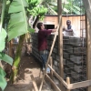 Passing bricks hand to hand