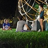 The Earth We Inhabit in the park with dancers