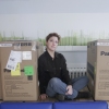 Sabrina Raaf with her ready to be shipped artwork.