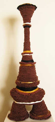 "The Potbellied Stackup" is a felted, stacked fabric mixed media piece of contemporary fiber art by Linda Thiemann.