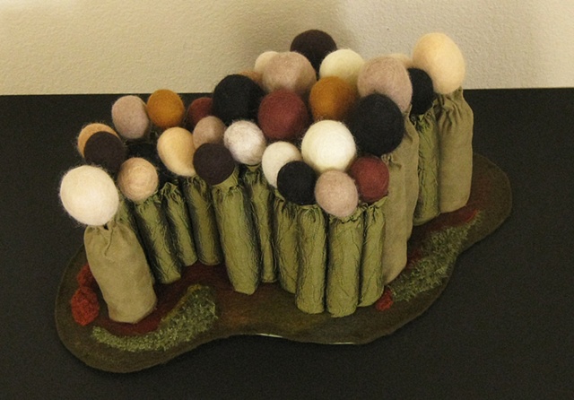 Linda Thiemann's Mixed media fiber sculpture "Unity" is a piece that promotes diversity.
