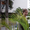 Marcus hiding behind the planters