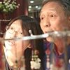 Father and daughter at their jade stall, Guangzhou, South China