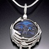 Carved labradorite moonface in the trees, silver