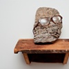 Rock Head with Glasses on Shelf