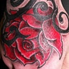 Rose on hand tattoo