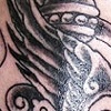 winged dagger tattoo