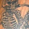 skeleton with saxaphone tattoo