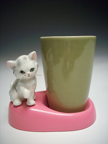 CAT WITH WISKERS AND CUP