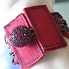 Braided cuff in brown and red