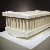 a moon of saturn resting on a doric foundation