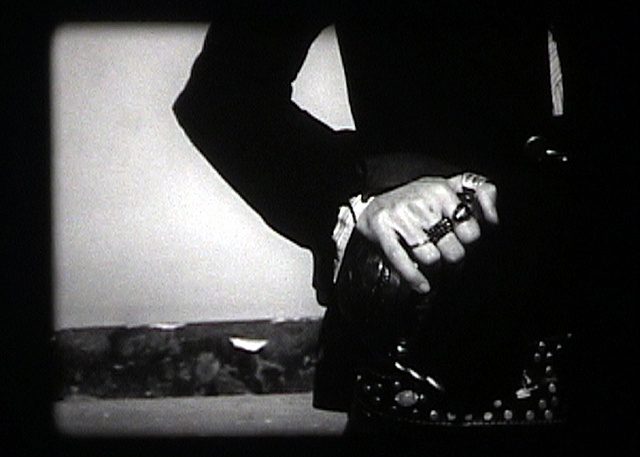 Still from The Sea Calls Us Home (Hand on Sword)